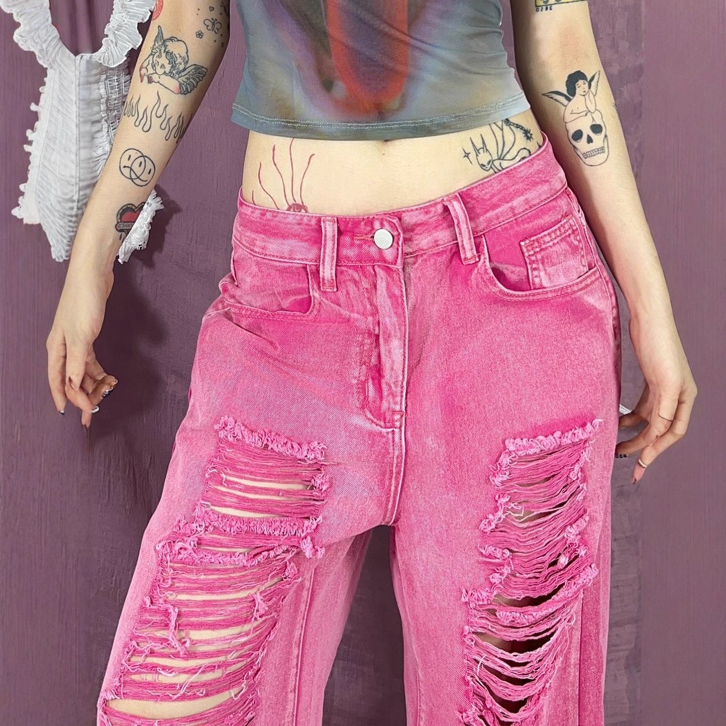 Perforated and hollowed out low waisted jeans for women