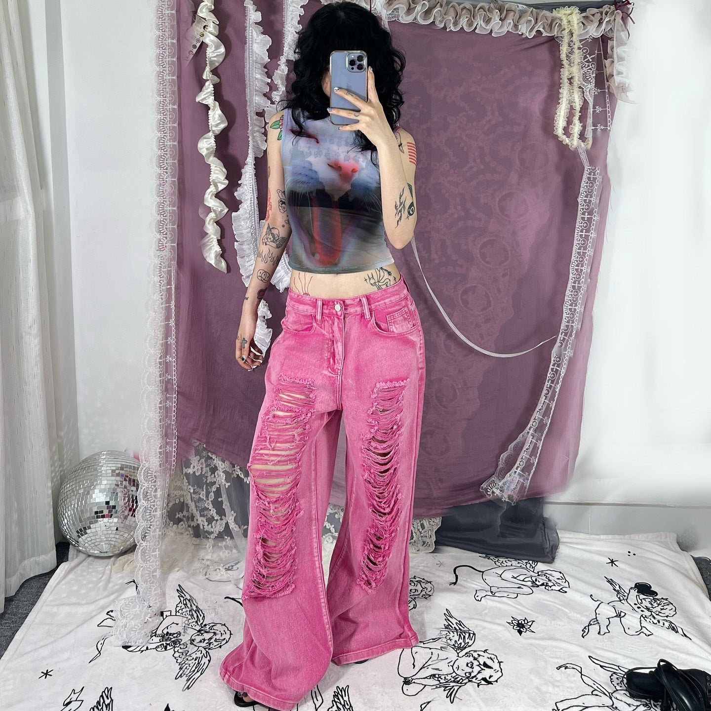 Perforated and hollowed out low waisted jeans for women